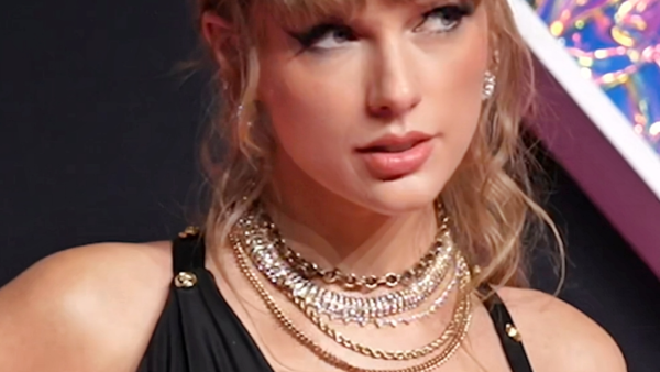 Taylor Swift Debuts a Shorter Curly Lob in New Photo